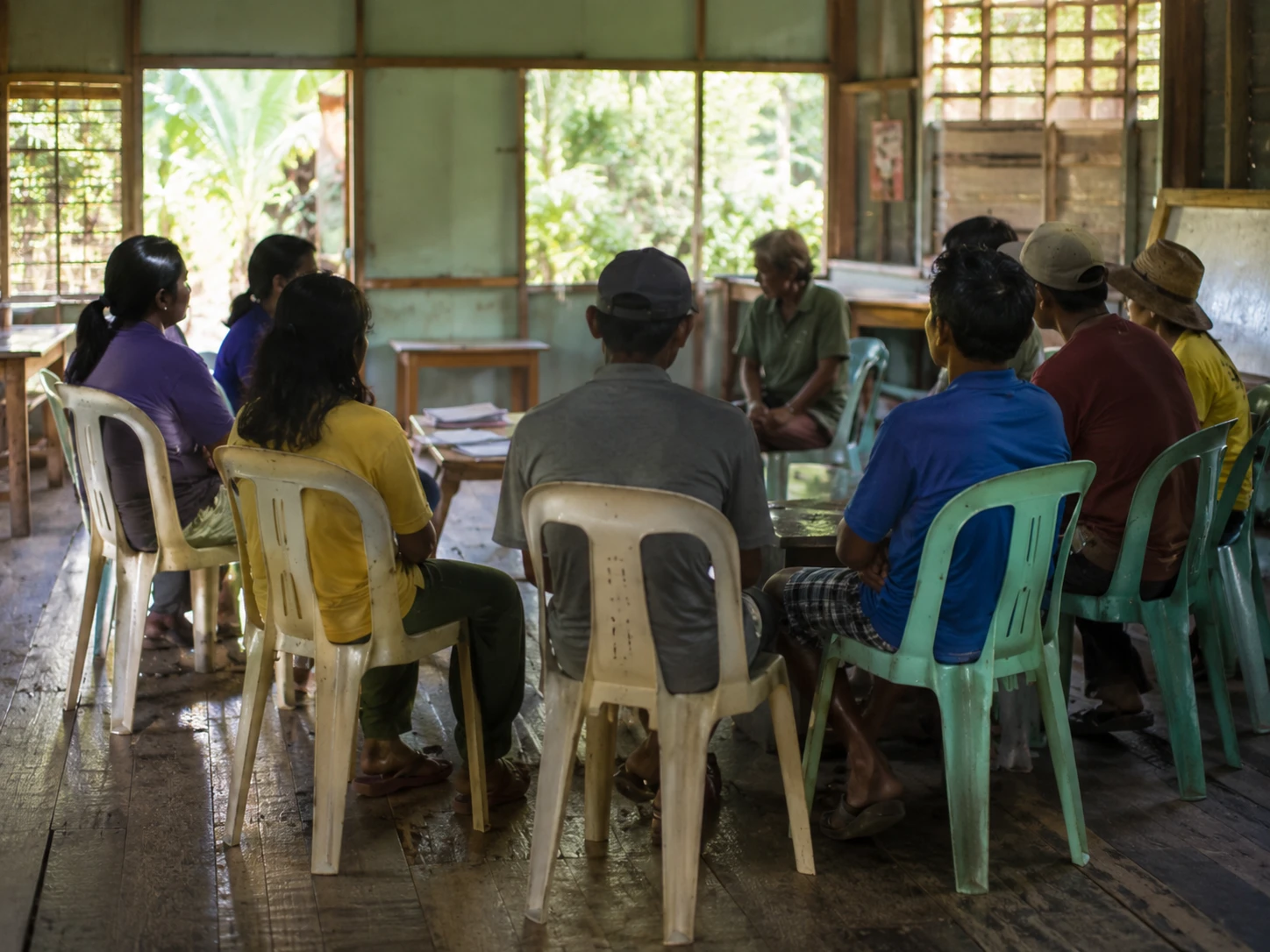 A small group meeting inside a community cooperative hall